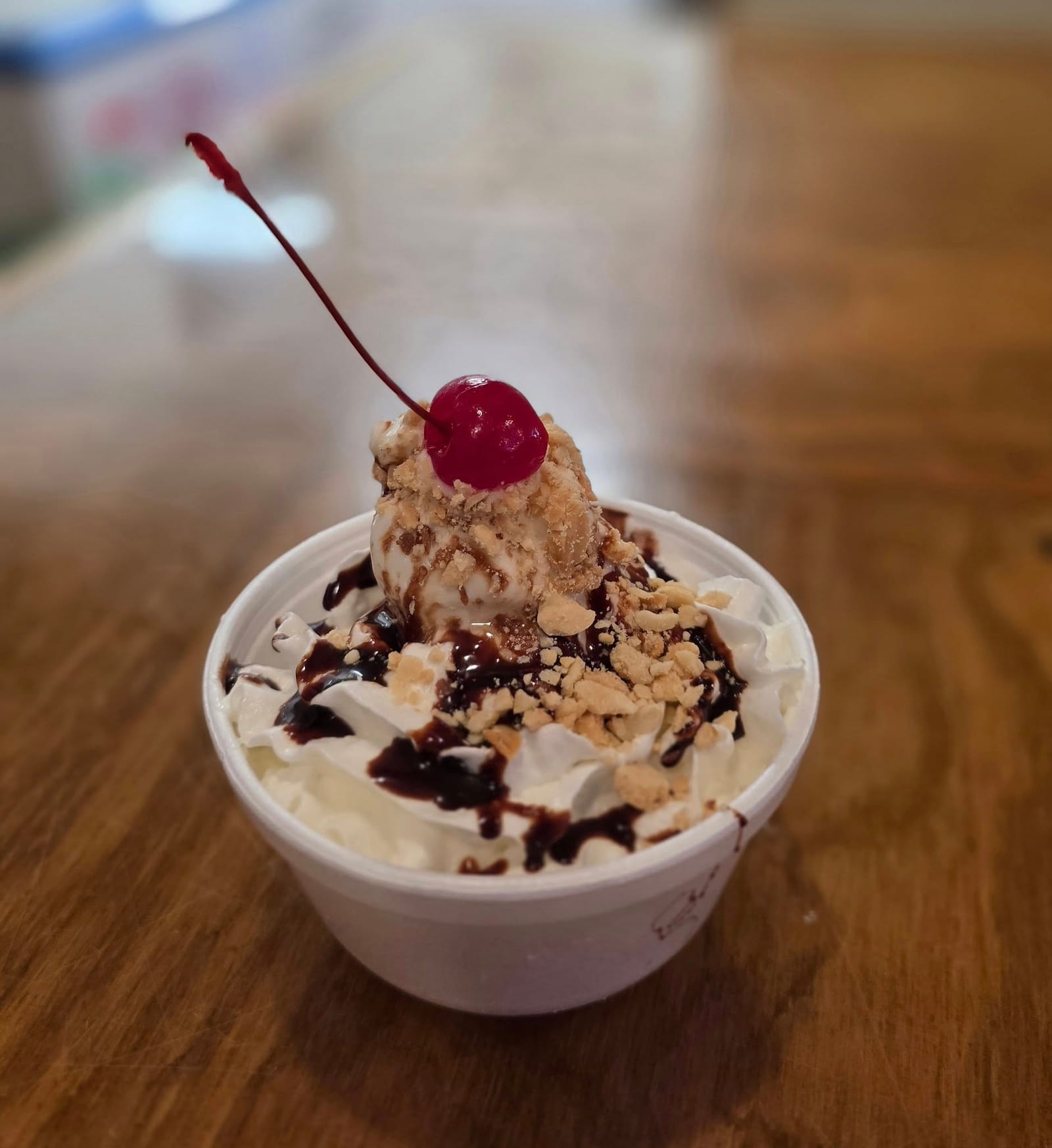 An ice-cream sundae with whipped cream, chocolate sauce, and a cherry at The Coney Island in Pottsville, PA.