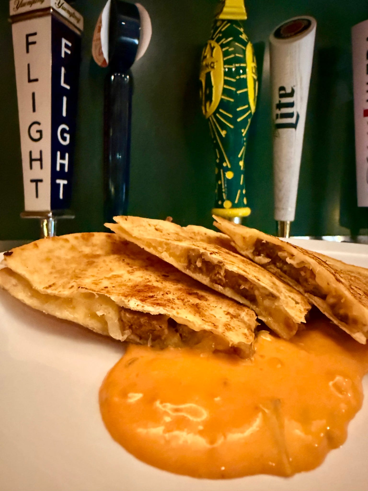 A quesadilla cut into wedges with dipping sauce at The Coney Island in Pottsville, PA.