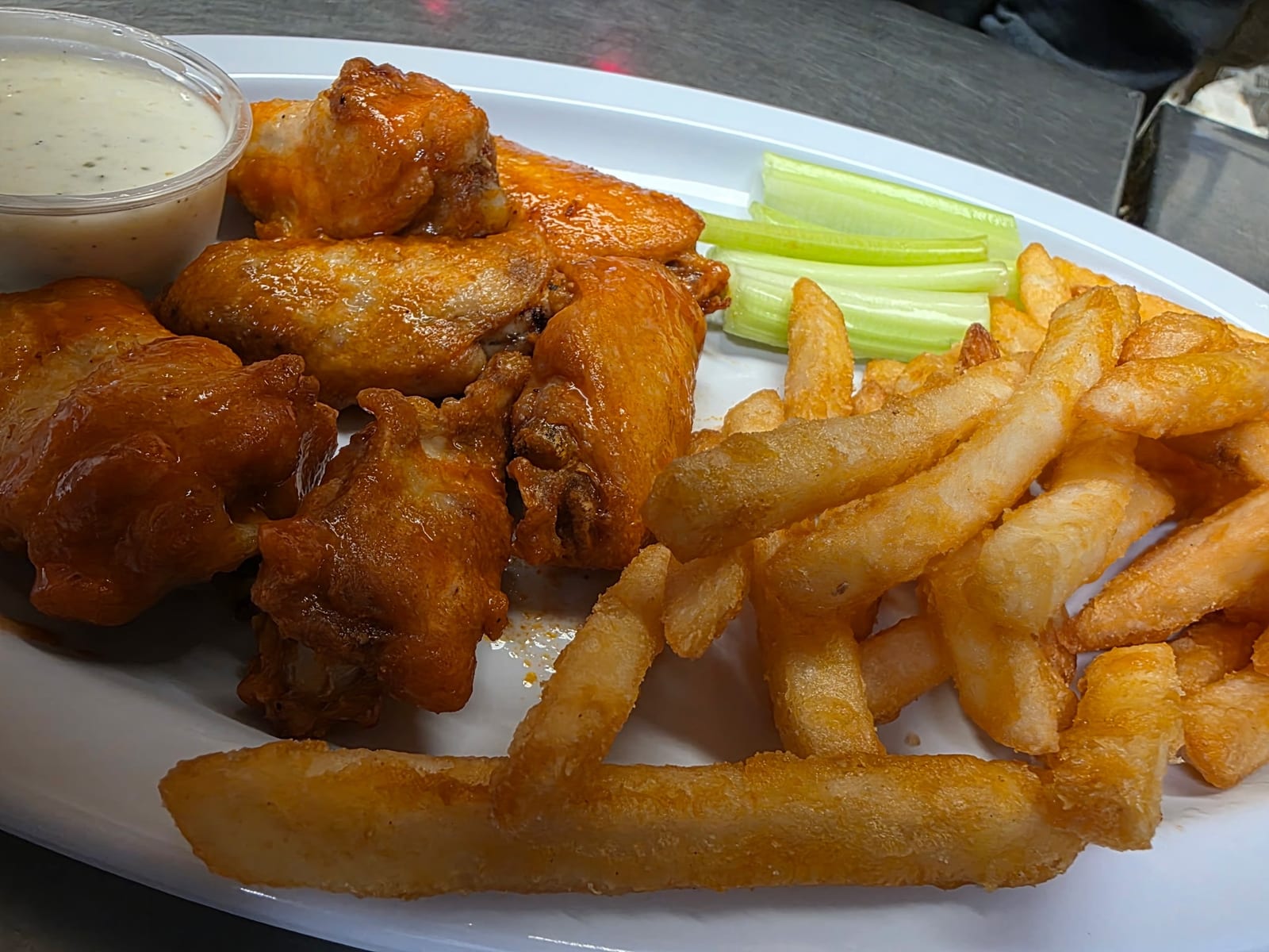 Buffalo wings with fries and celery at The Coney Island in Pottsville, PA.