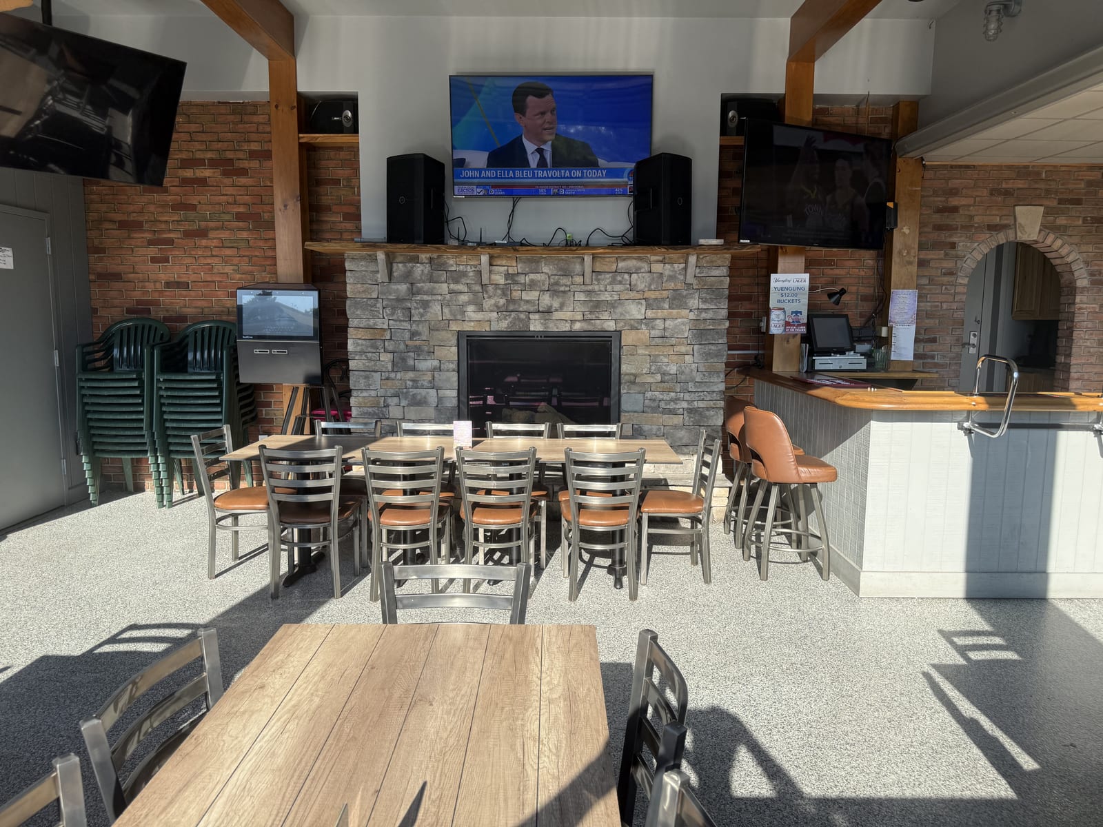 The working fireplace inside the four-season patio at The Coney Island in Pottsville, PA — keeps the room warm through Pennsylvania winters.